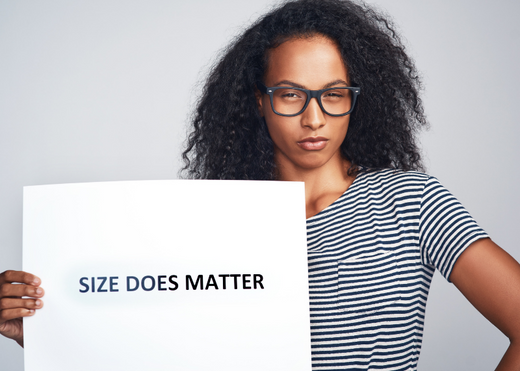 Woman holding Size Does Matter sign