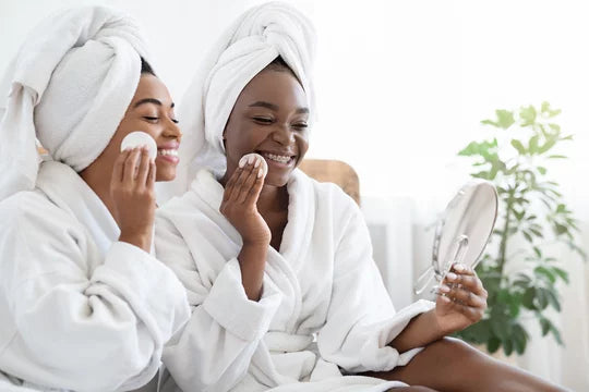 Women with cotton pads on face