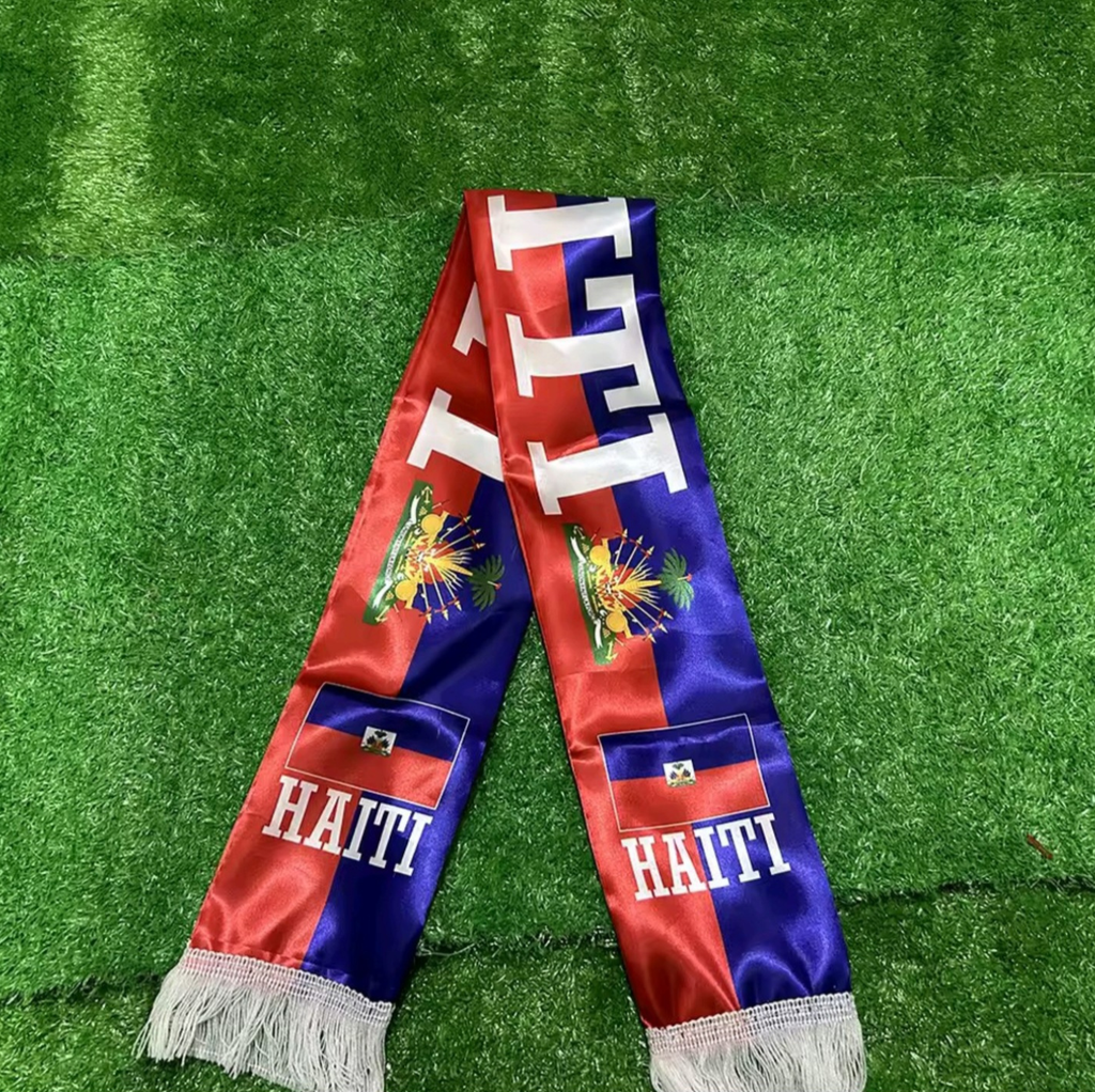 Scarf with Haiti text and flags on a green grass background