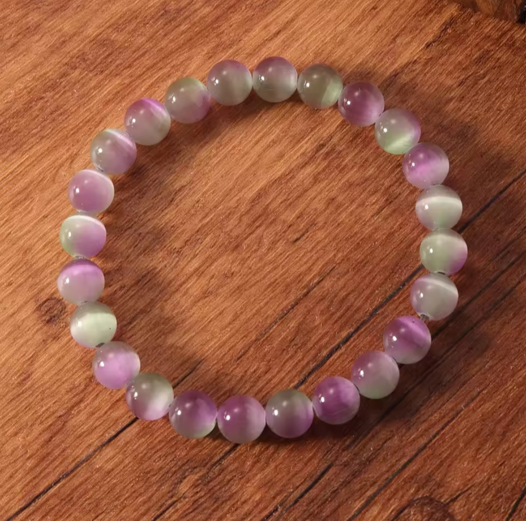 Multicolored beaded bracelet on a wooden surface