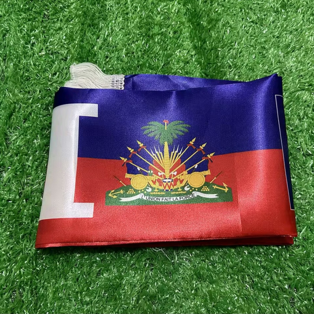 Flag of Haiti on a grass background