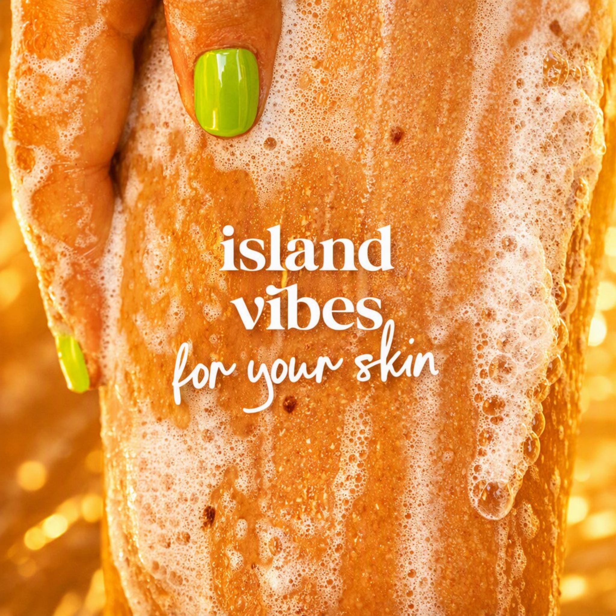 A close-up of a hand with bright green nails holding a foamy, golden-brown textured skin, with the text 'island vibes for your skin' overlaid in white script and serif fonts.
