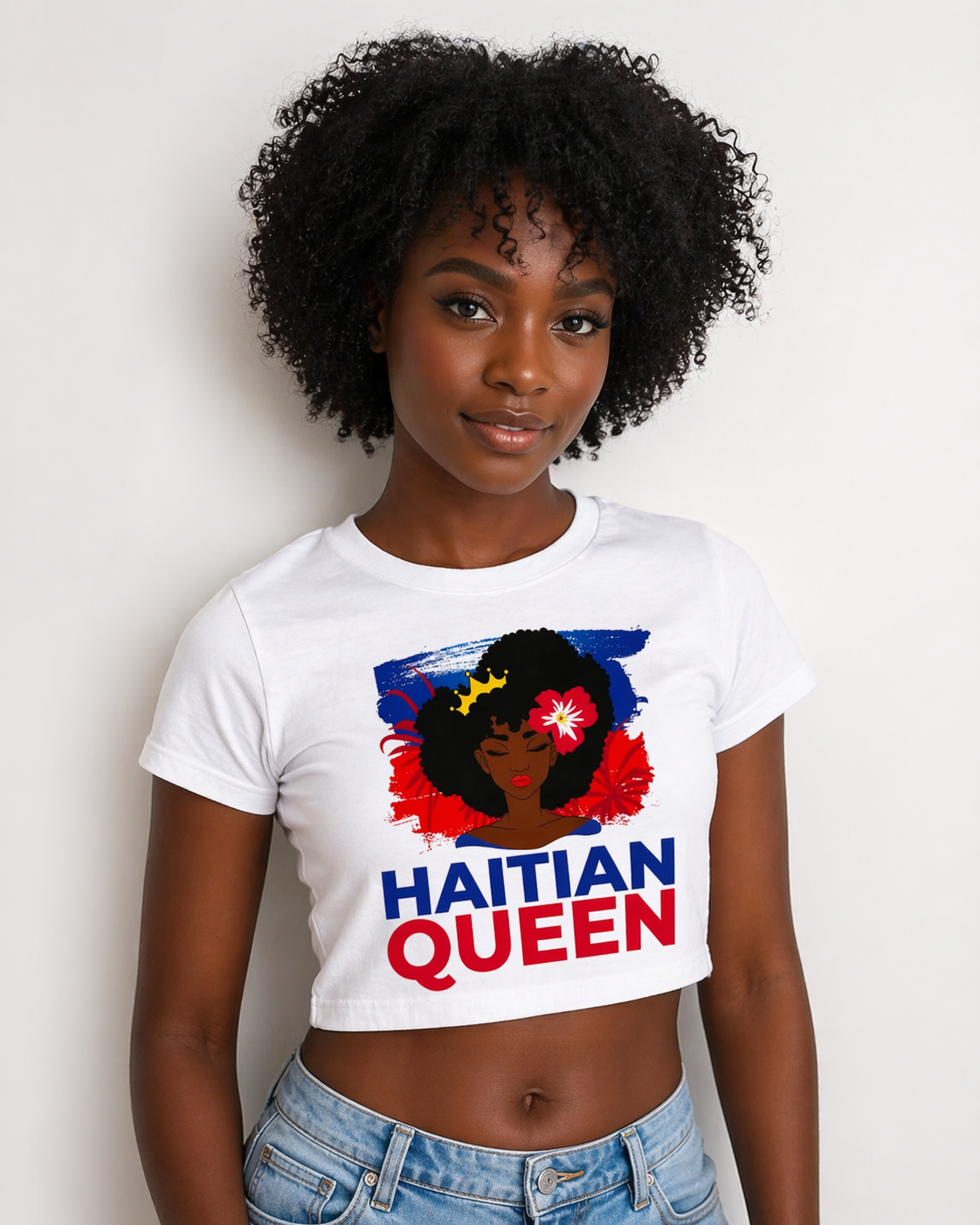 Woman wearing a white t-shirt with 'Haitian Queen' design on a plain background