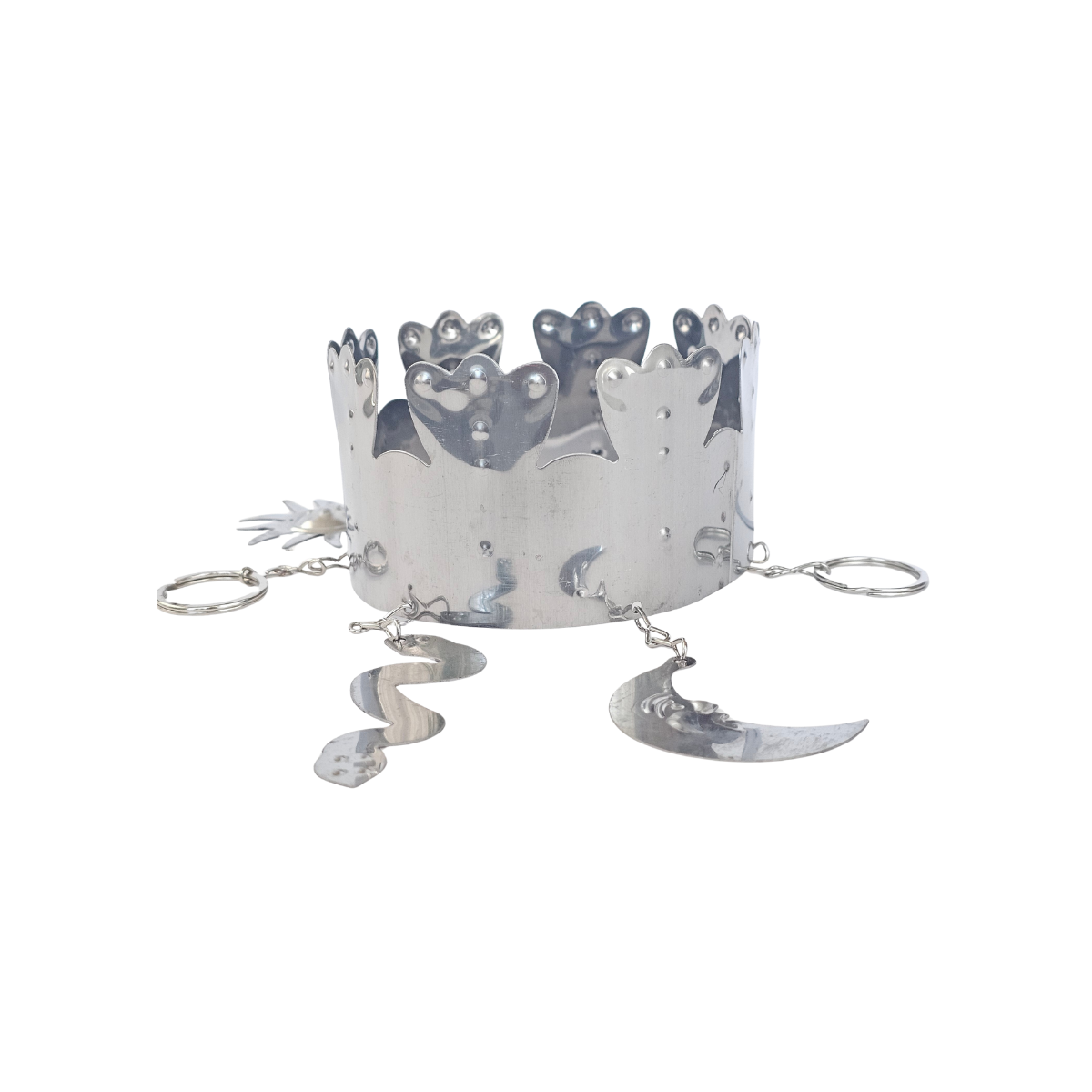 Silver crown with moon and star designs on a white background