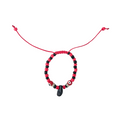 Beaded bracelet with red and black beads on a white background