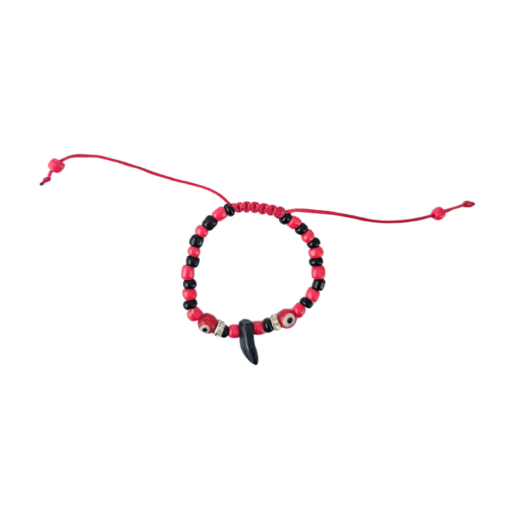 Beaded bracelet with red and black beads on a white background