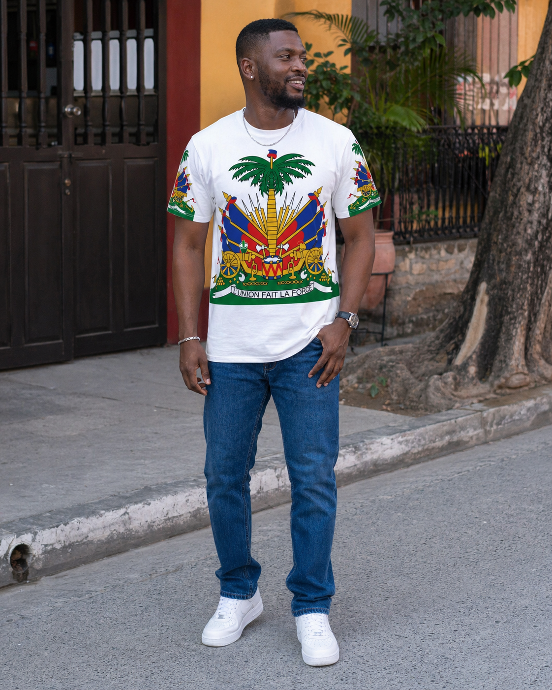 Man wearing Haitian shirt with white sneakers 