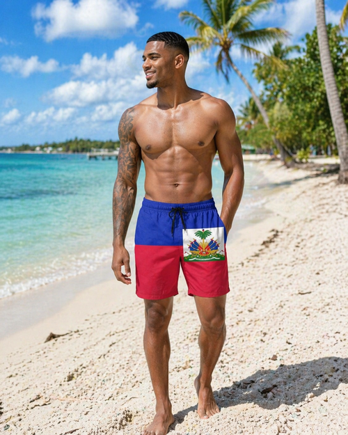 Man wearing a swimsuit with a Haitian flag design on a beach. Lakay Remedies 