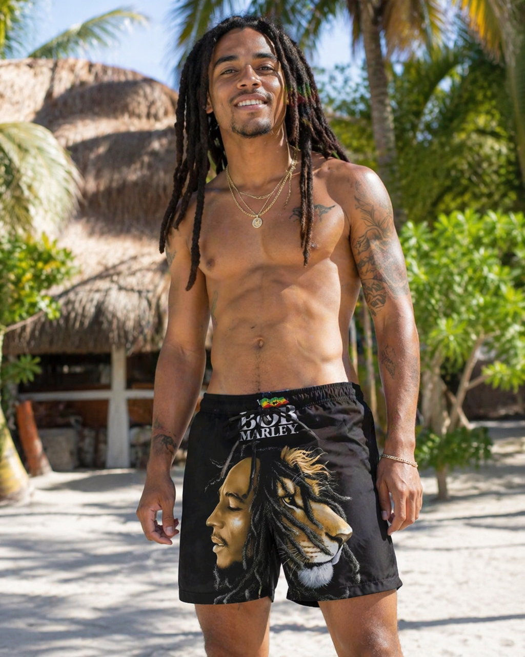 Man wearing black shorts with a lion design in a tropical setting