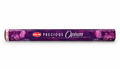 A roll of HEM Precious Opium Incense Sticks in a purple wrapper decorated with pink floral patterns, shown against a plain white background.