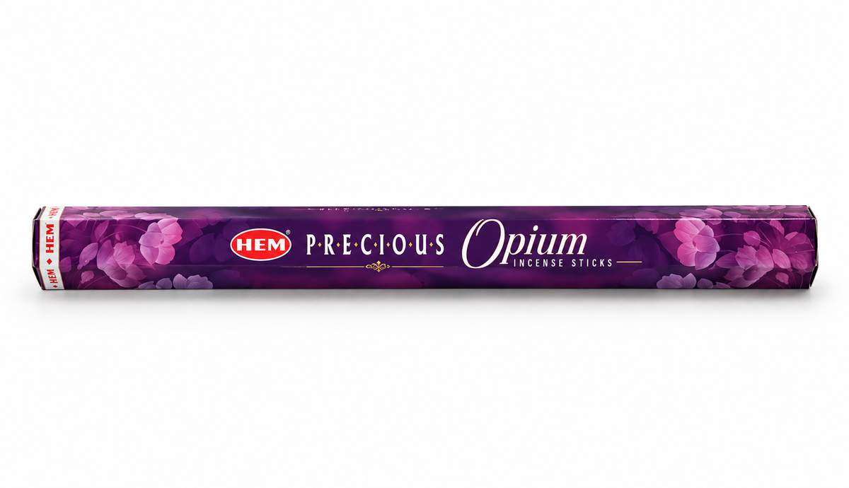A roll of HEM Precious Opium Incense Sticks in a purple wrapper decorated with pink floral patterns, shown against a plain white background.