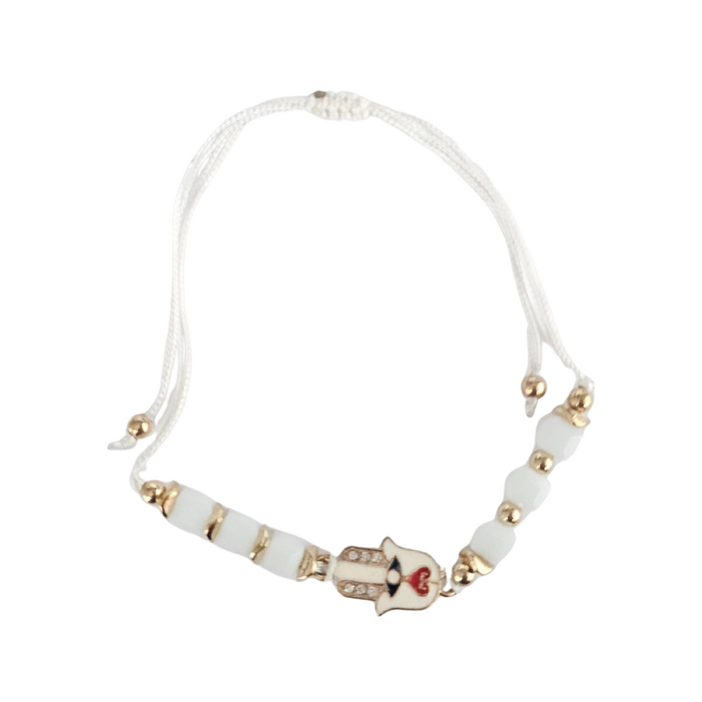 White bracelet with white beads and a hamsa hand charm on a white background
