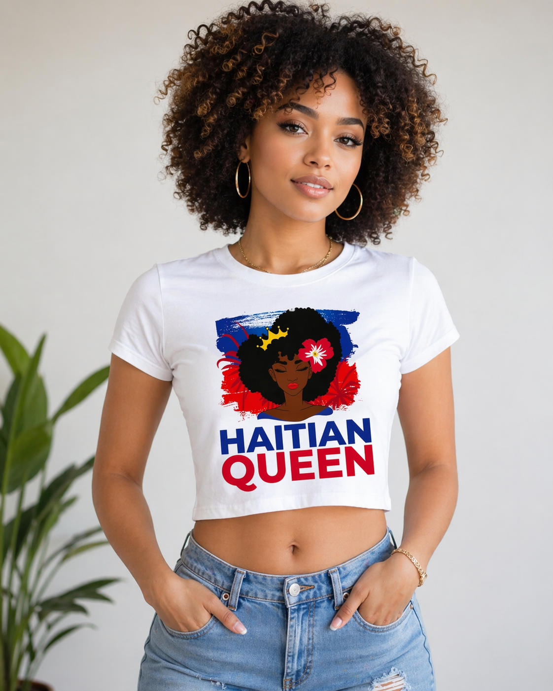 Woman wearing a white t-shirt with 'Haitian Queen' design against a neutral background