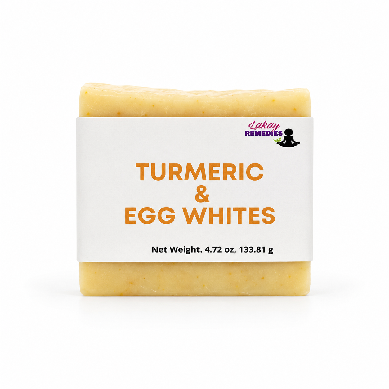 A bar of soap labeled 'Turmeric & Egg Whites' by Lakay Remedies, featuring a white paper label with orange text and a yellow-turmeric soap bar visible at the top and bottom, on a white background.