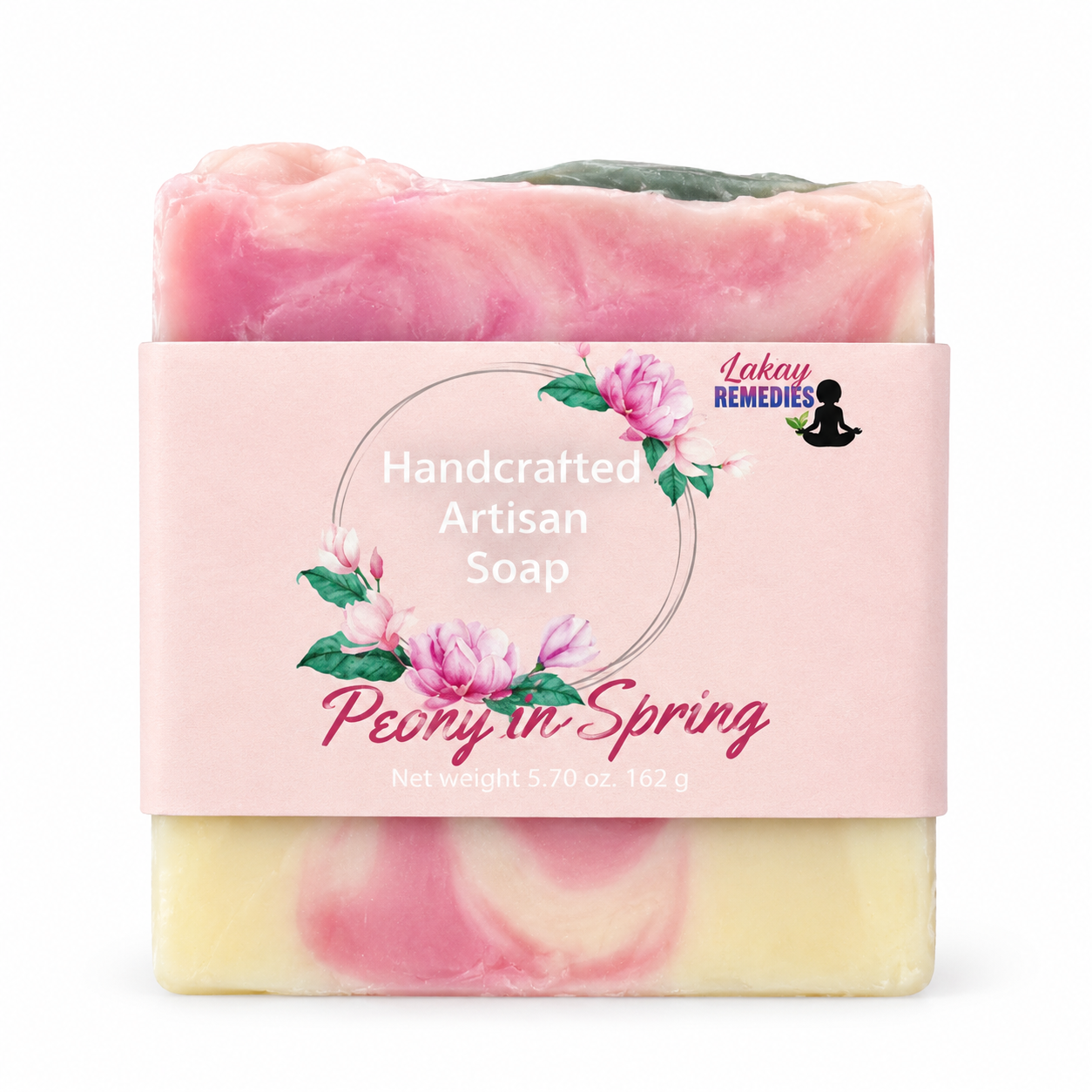 A handcrafted artisan soap bar wrapped in a pink paper label that reads 'Handcrafted Artisan Soap Peony in Spring' with 'Lakay Remedies' branding. The soap has pink and pale yellow marbled swirls with a small green patch on top, shown against a plain white background.