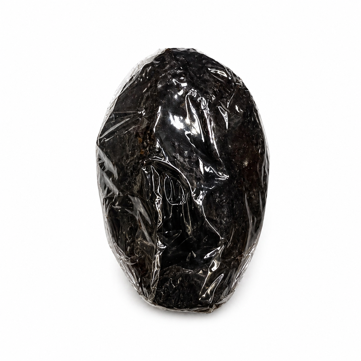 Black vagina candle in clear plastic packaging on a white background