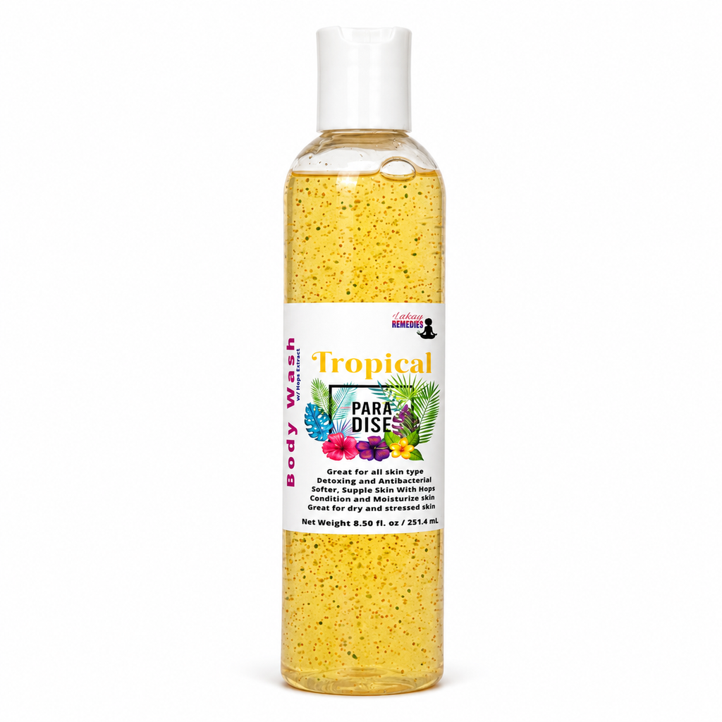 A clear plastic bottle of Tropical Para-Dise Body Wash filled with yellow speckled liquid, featuring a white cap and a white label with tropical fruit illustrations.