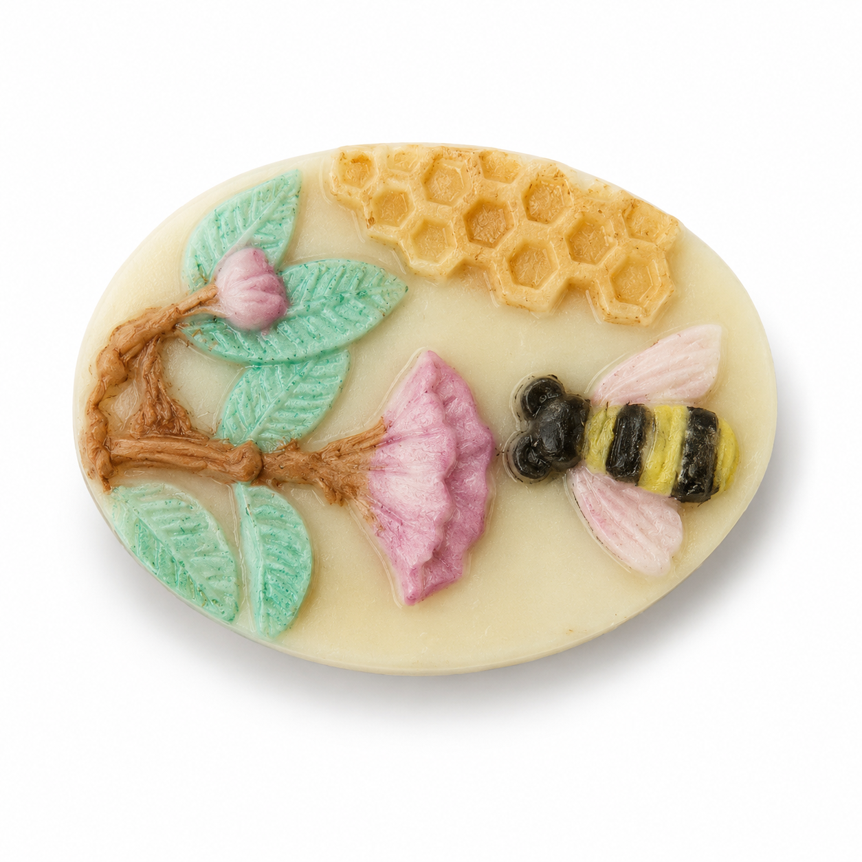An oval cream-colored soap or resin plaque featuring a raised bee, pink flower, green leaves, and yellow honeycomb on a white background.