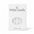 A white rectangular box containing five white 6-inch candles, with a circular cutout showing the candles inside. The box has black text reading '6" White Candle' and '5 Pcs in a Pack' at the bottom, set against a plain white background.