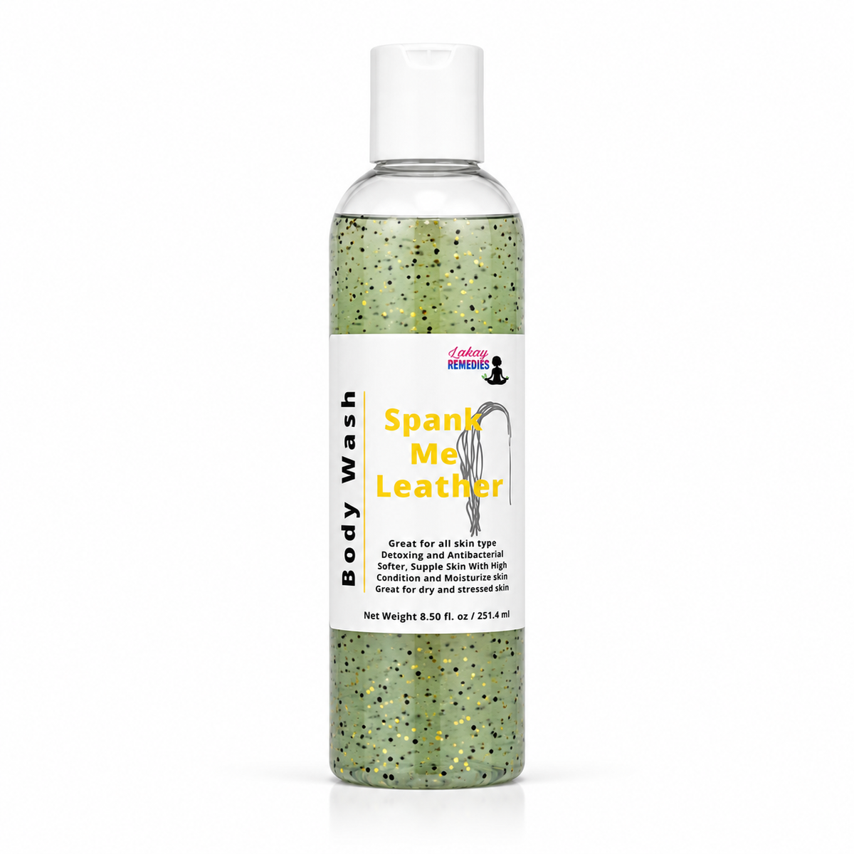 A clear plastic bottle of body wash with a white cap and a white label reading 'Body Wash' and 'Spank Me Leather' in yellow text. The liquid inside is green with black and gold jojoba beads.