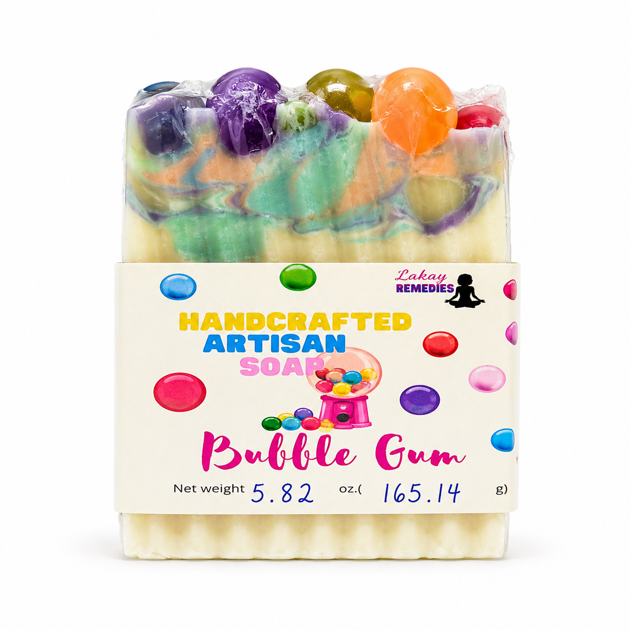 A packaged handmade artisan soap bar with a cream-colored base, colorful green and purple swirls, and raised bubble gum candy decorations on top. The soap is wrapped in clear plastic and has a white paper label that reads 'HANDCRAFTED ARTISAN SOAP Bubble Gum' with 'Lakay Remedies' branding.