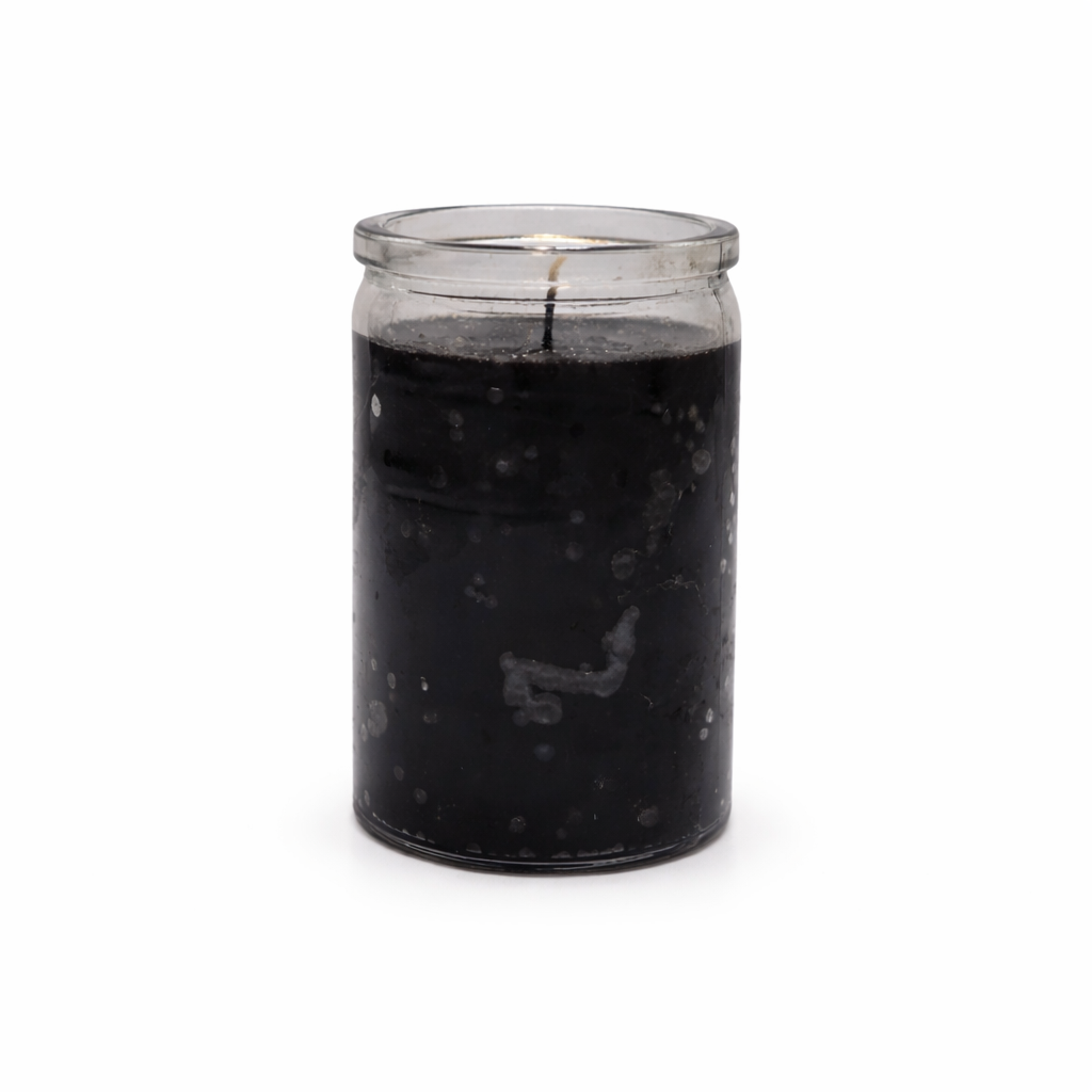 Black candle in a glass jar on a white background