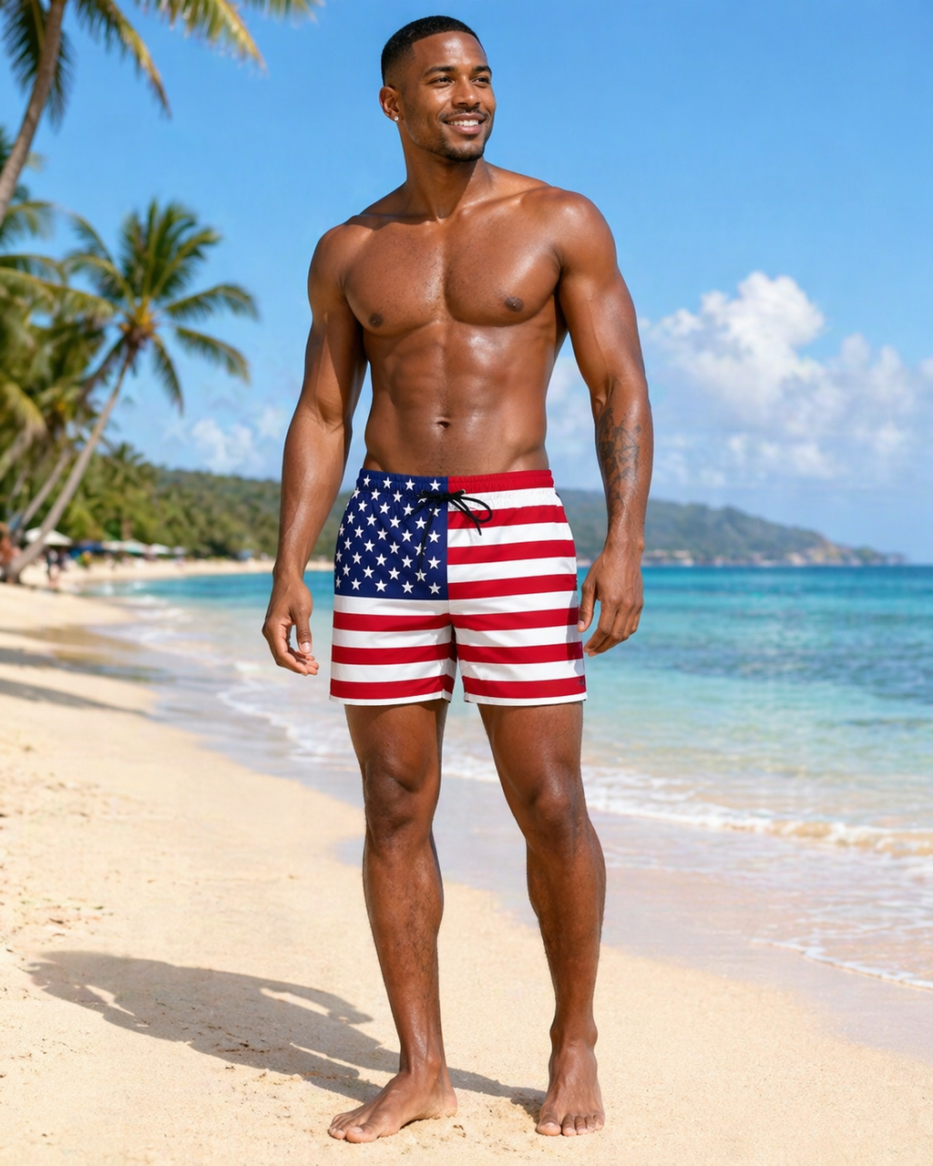 Man wearing American flag swim shorts on a tropical beach
