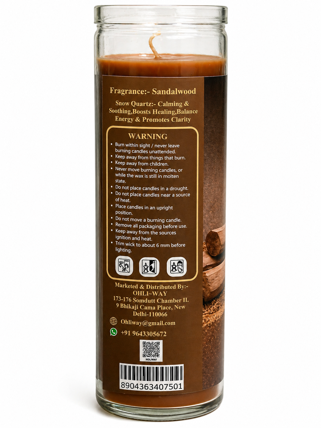 Candle with sandalwood fragrance and warning label on a white background