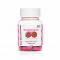 A clear plastic bottle of Bootylicious Plumping & Enhancement pills with a white cap, containing pink capsules, on a white background.