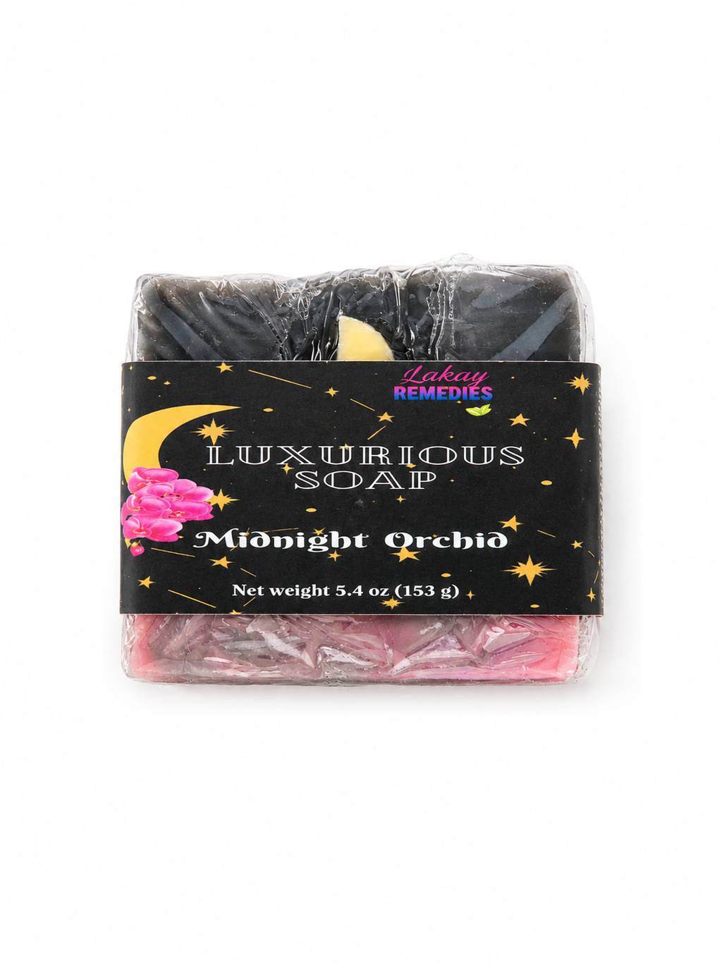 A packaged bar of Luxurious Soap named 'Moonlit Orchid' by Lakay Remedies, wrapped in clear plastic with a black label featuring gold stars and a pink flower illustration.
