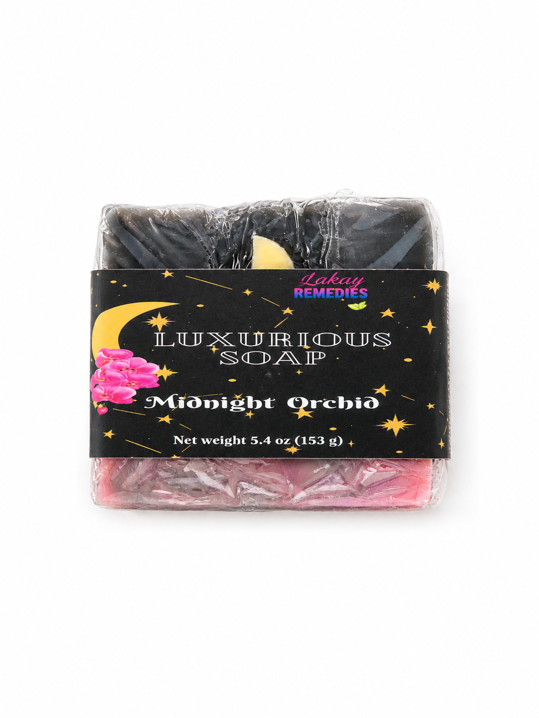 A packaged bar of Luxurious Soap named 'Moonlit Orchid' by Lakay Remedies, wrapped in clear plastic with a black label featuring gold stars and a pink flower illustration.
