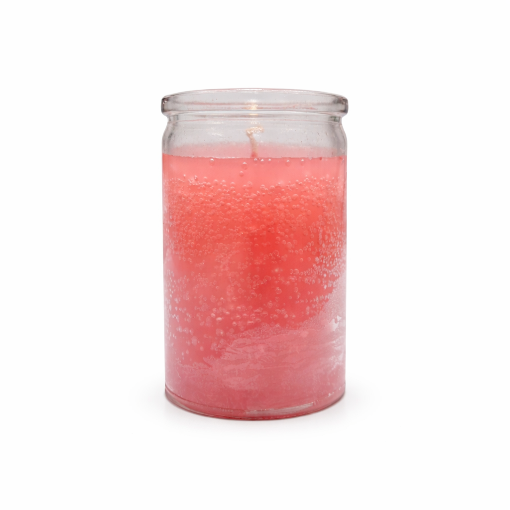 Pink candle in a glass jar on a white background