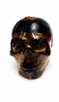 skull sculpture candle on a white background