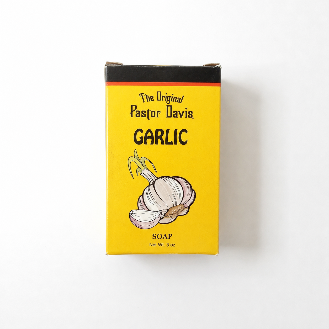 A 3 oz box of The Original Pastor Davis Garlic Soap, featuring a bright yellow label with a black top border, black text, and an illustration of a garlic bulb on a white background.