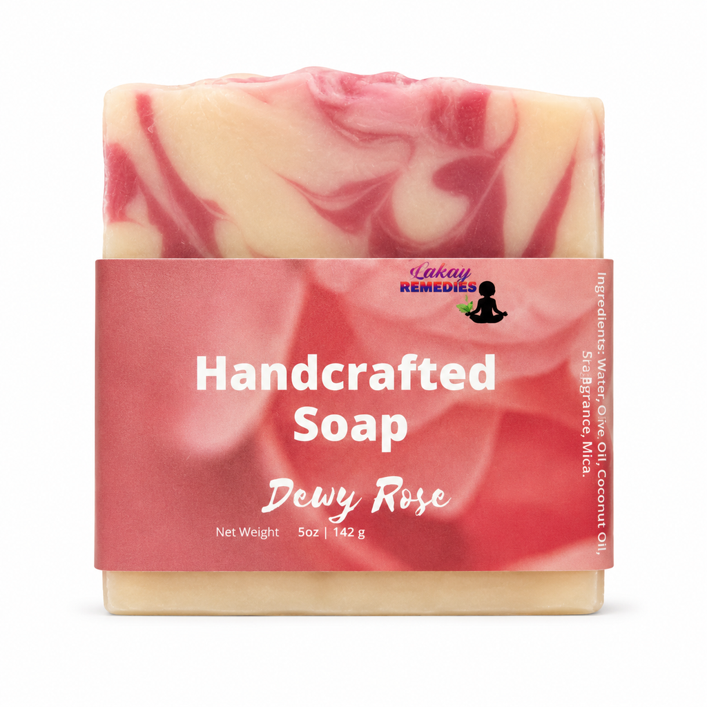 A 5 oz bar of handcrafted soap labeled 'Dewy Rose' by Inkay Remedies, featuring a pink and cream marbled pattern with a pink paper label.