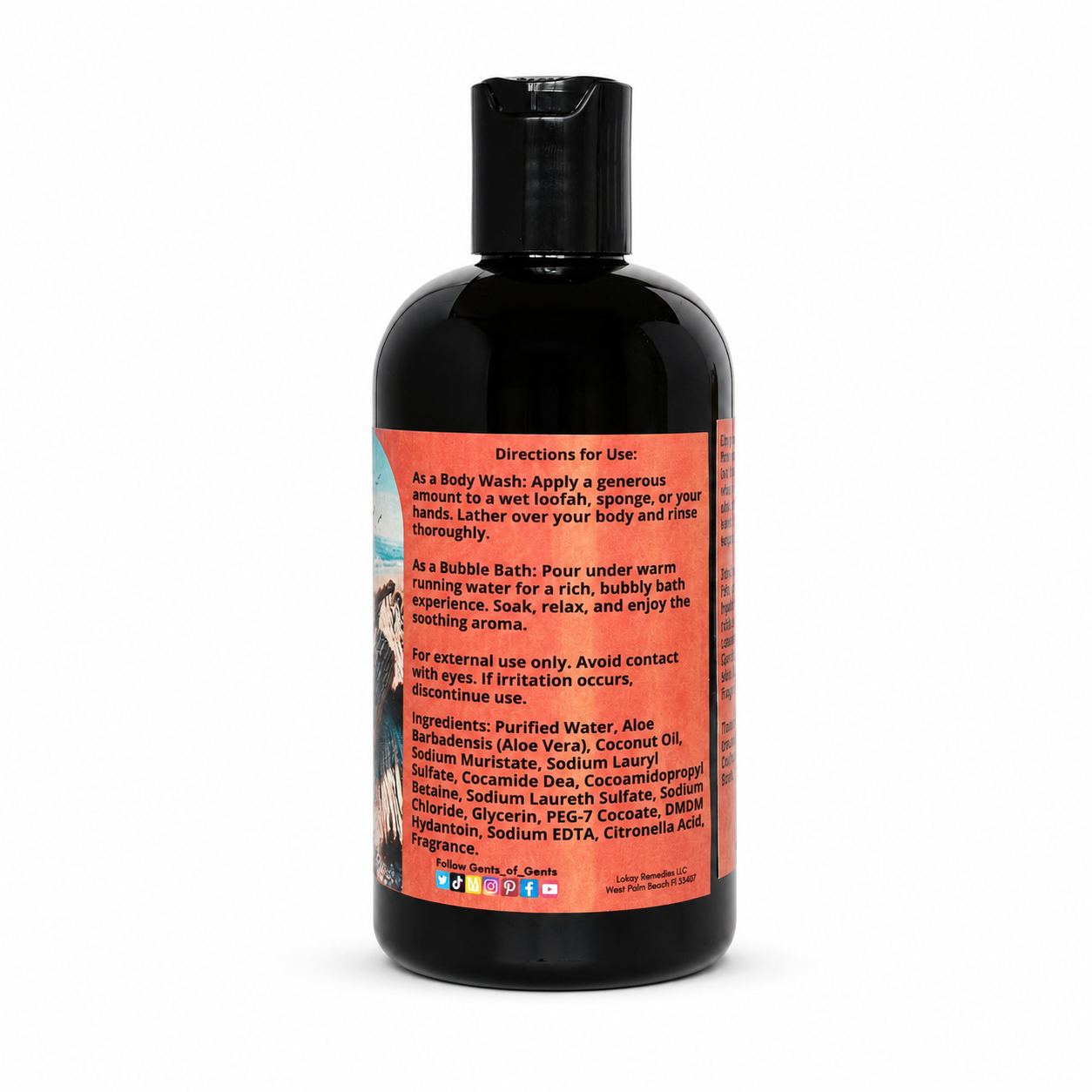A black bottle of body wash with a bright orange label showing directions and ingredients, photographed on a plain white background.