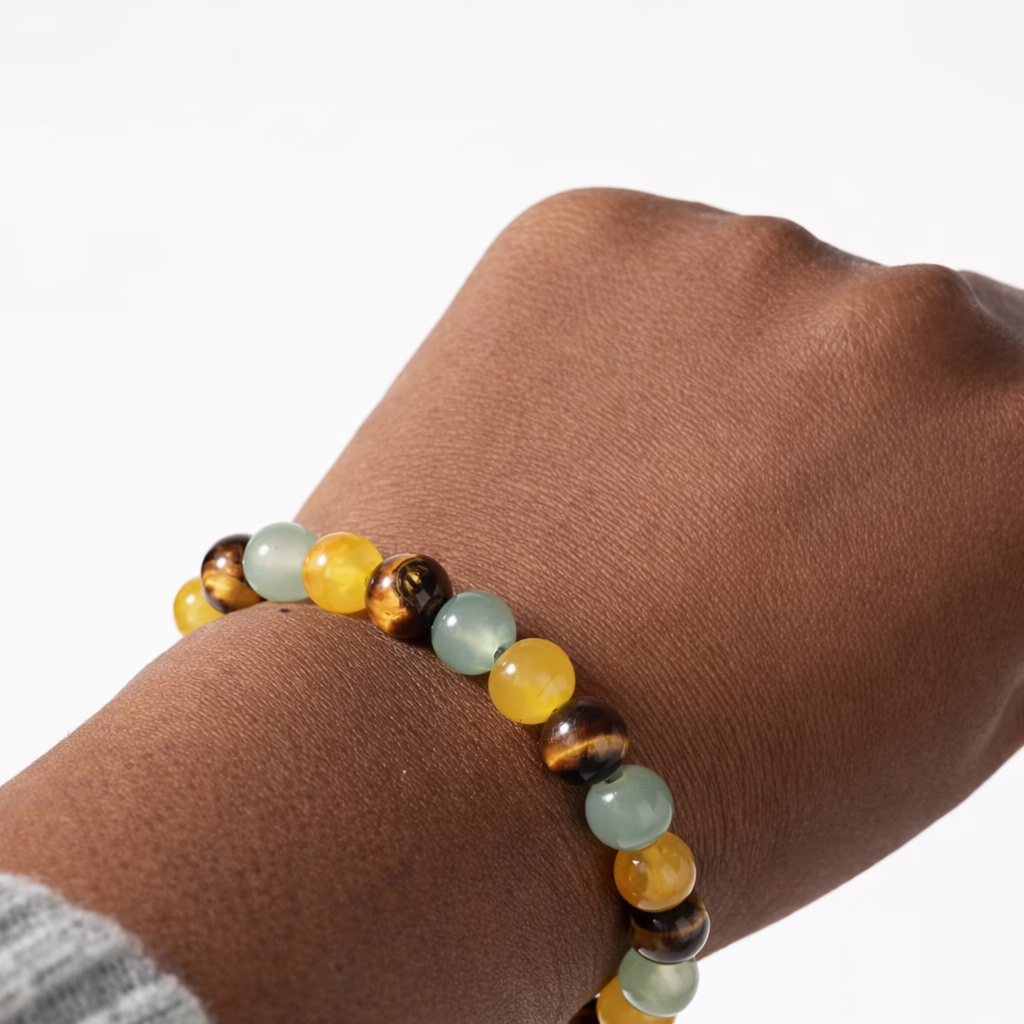 Beaded bracelet on a wrist with a neutral background