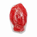 Red vagina candle in clear plastic packaging on a white background