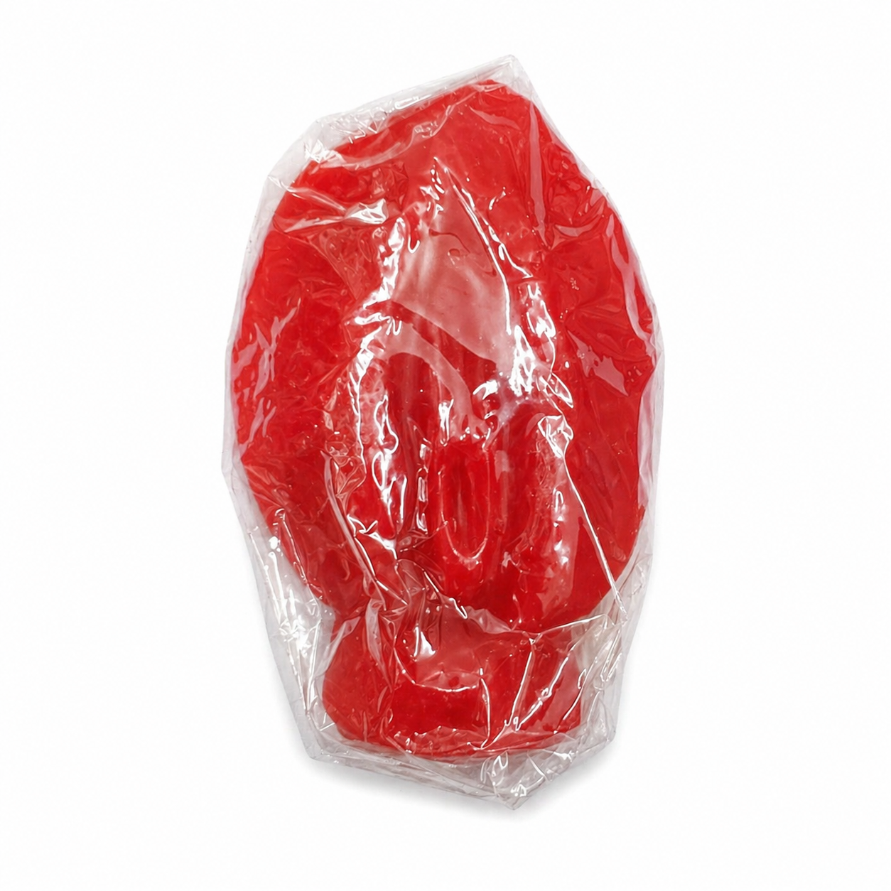 Red vagina candle in clear plastic packaging on a white background