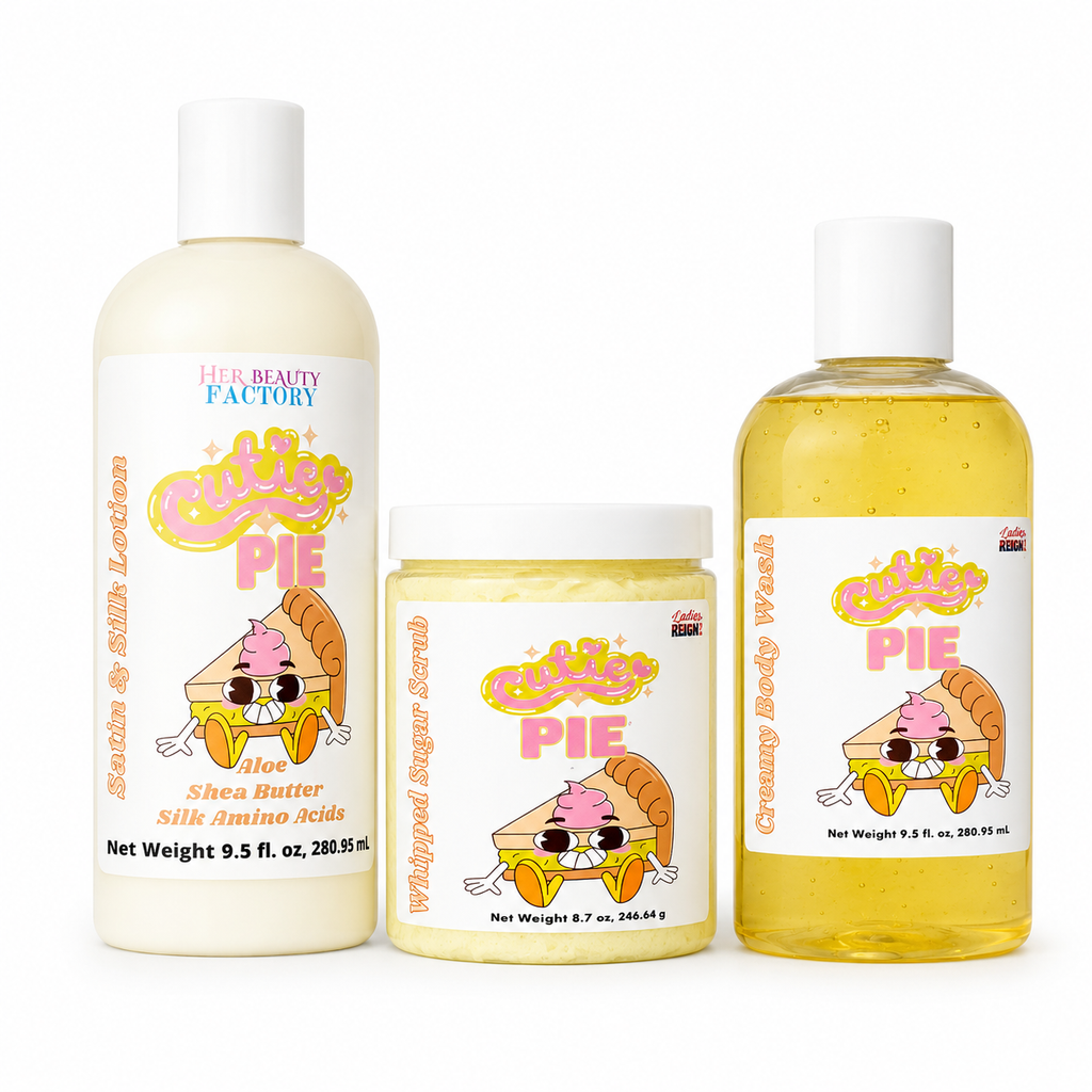 Three cosmetic products from Her Beauty Factory against a white background: a large bottle of Shea Butter Silk Amino acids Lotion on the left, a jar of Whipped Sugar Scrub in the center, and a bottle of Creamy Body Wash on the right. All feature a 'Cute Pie' character label.