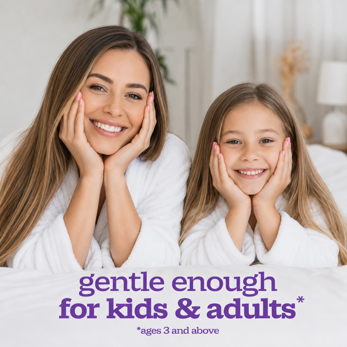 A smiling woman and a young girl both resting their heads on their hands, wearing white bathrobes in a bright bedroom setting. Purple text at the bottom reads 'gentle enough for kids & adults' with a small note '*ages 3 and above'.