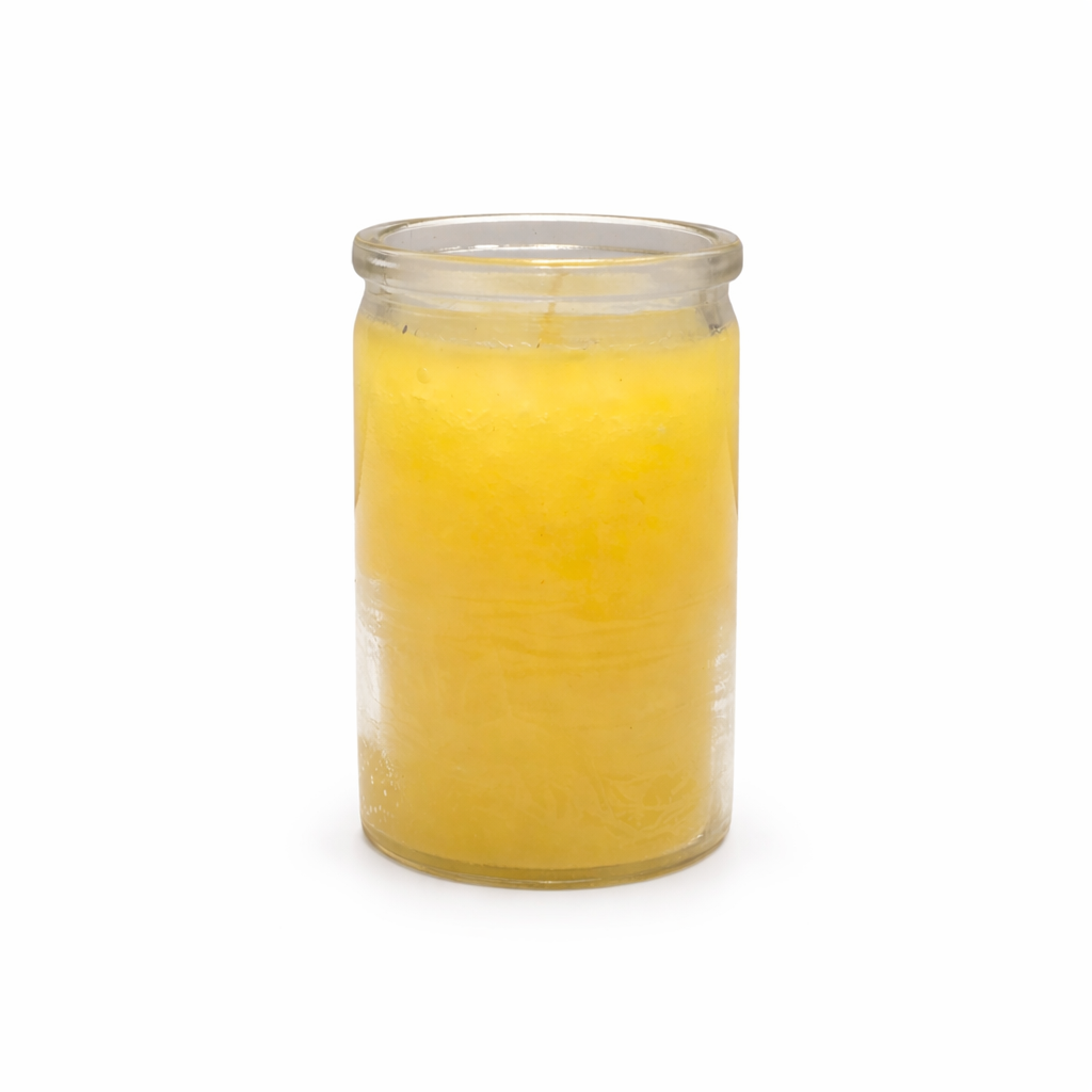 Clear glass jar filled with yellow candle on a white background