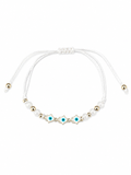 Delicate bracelet with pearls, blue beads, and gold accents on a white background