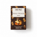 A box of Ohli-Way Holy Wood incense (Jabón) on a clean white background. The packaging is dark brown with gold illustrations of wood shavings and a central white label containing the brand name and product type.