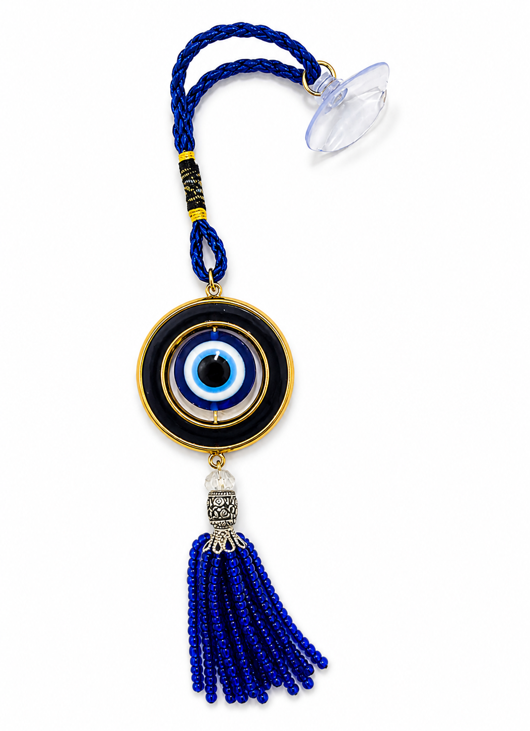 Blue evil eye charm with tassel on a white background