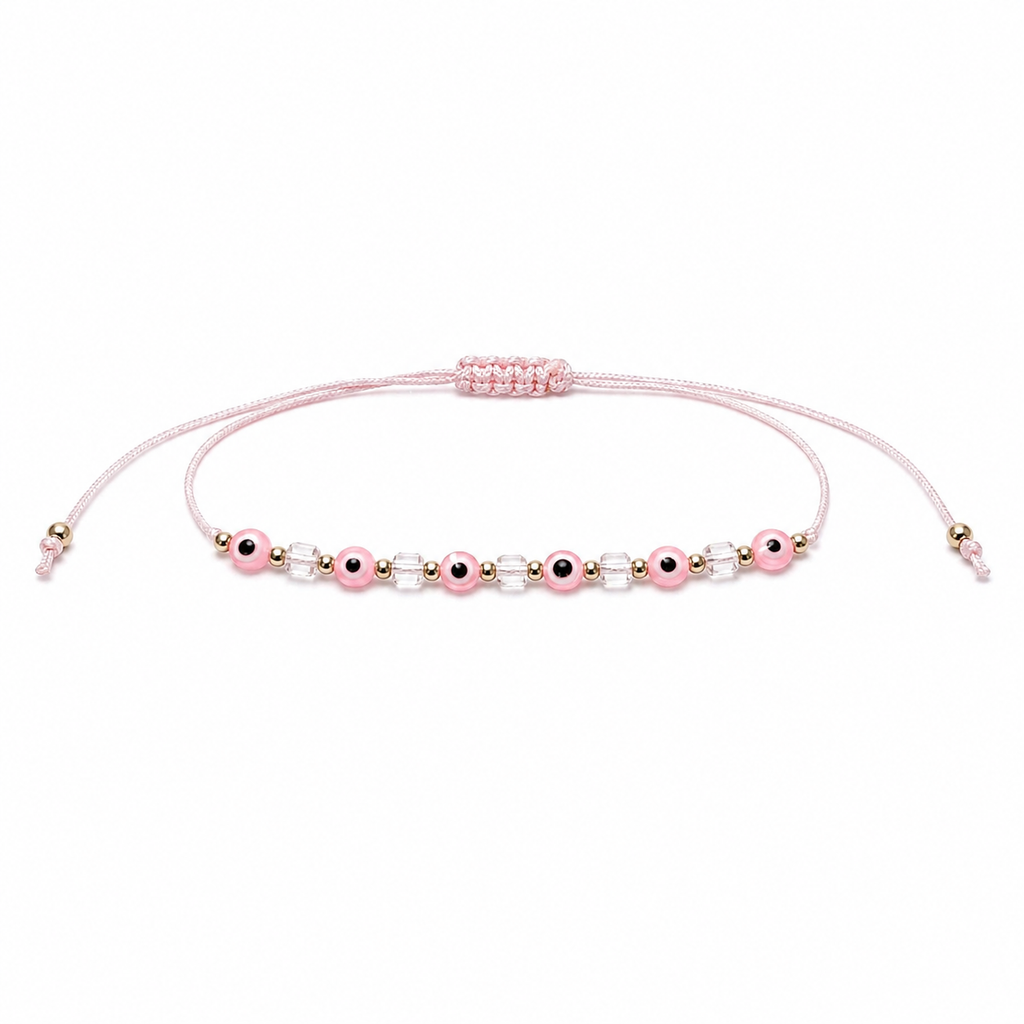 Pink beaded bracelet on a white background