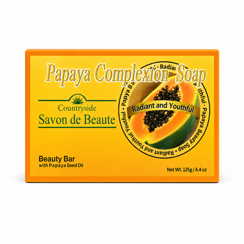 A rectangular box of Papaya Complexion Soap by Countryside Savon de Beaute, featuring a bright yellow-orange design with a central illustration of a sliced papaya and text indicating it is a Beauty Bar with Papaya Seed Oil.