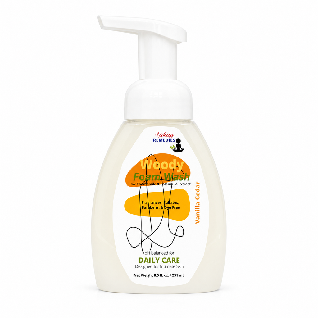 A bottle of Soapy Remedies Woody Foam Wash in Vanilla Cedar scent, featuring a white pump dispenser and a label with orange and green graphics on a white background.