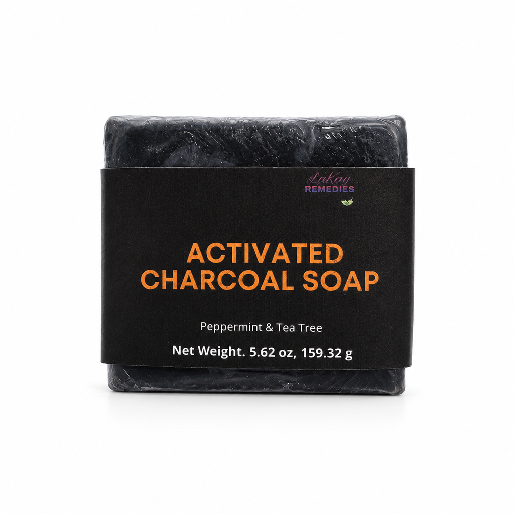 A single bar of charcoal soap wrapped in a black paper sleeve with orange and white text, reading 'ACTIVATED CHARCOAL SOAP' and 'Peppermint & Tea Tree,' on a white background.