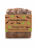 A packaged bar of handmade artisan soap labeled 'Peppermint Coffee' on a plain white background. The soap is wrapped in clear plastic with a brown kraft paper label featuring green leaf illustrations and black text.